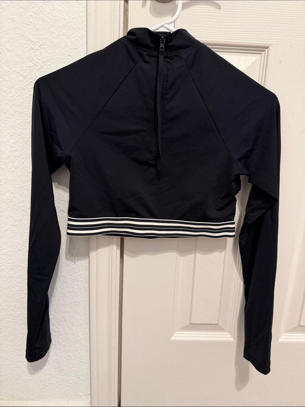Athleta Black Long-Sleeve Cropped Athletic Top with White Striped Hem